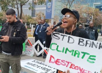 Activists forcibly evicted from Standard Bank AGM as chair defends oil and gas finance