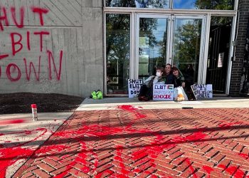 Nine are arrested at Central Square company during Middle East protest that grew violent