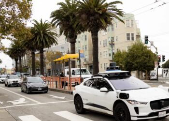 Alphabet is pouring billions into Waymo’s self-driving taxis as Tesla prepares to reveal its rival
